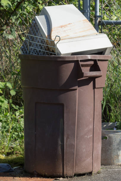 istock Garbage container with an old computer CRT monitor 958872530