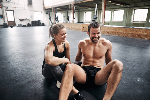 istock Fit people taking a break from exercising at the gym 958872764
