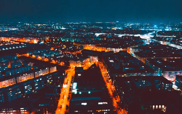 istock panoramic overview over berlin at night with blurred orange traffic lights 958872848