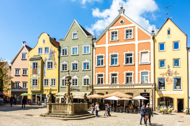 weilheim - bavaria, april 17: people visiting and shopping in the famous old town of weilheim in bavaria/germany on april 17, 2018