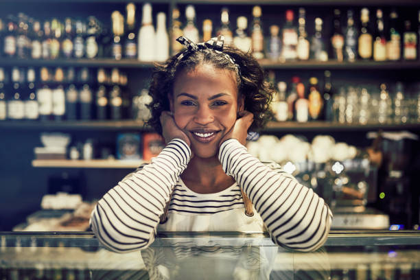 istock Smiling African entrepreneur standing in her trendy cafe 958877842