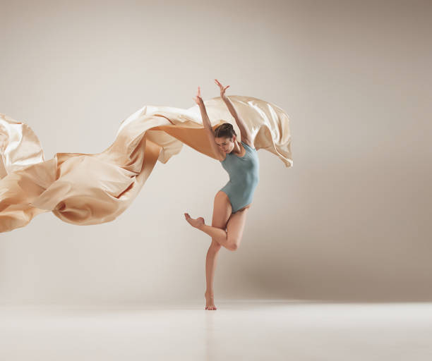 istock Modern ballet dancer dancing in full body on white studio background 958878448