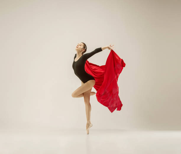 istock Modern ballet dancer dancing in full body on white studio background 958878574