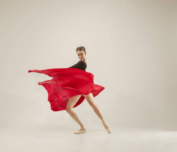 istock Modern ballet dancer dancing in full body on white studio background 958879026