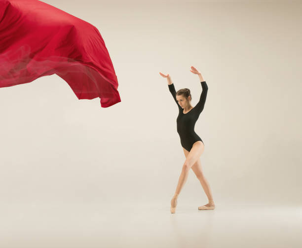 istock Modern ballet dancer dancing in full body on white studio background 958879214