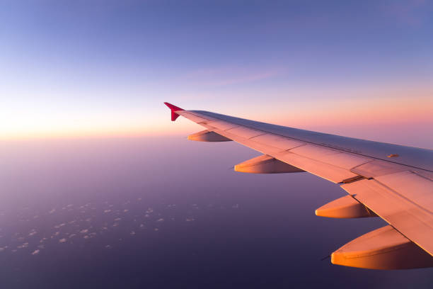 istock Clouds and sky sunny day through airplane window 958879546
