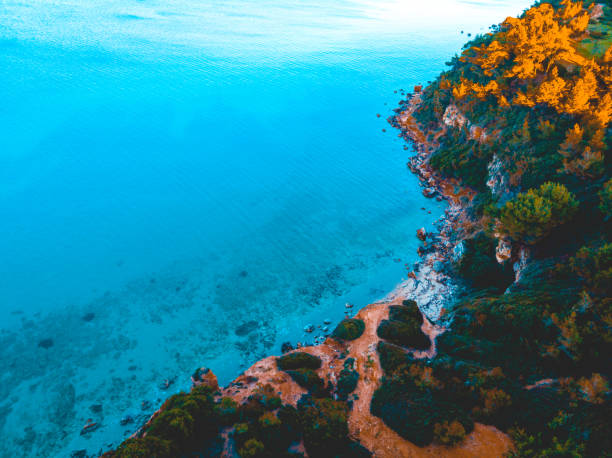 istock Rocky, limestone coastline and luminous blue sea 958882006