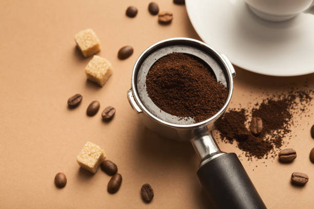 istock Coffee machine holder with ground roasted beans 958883542