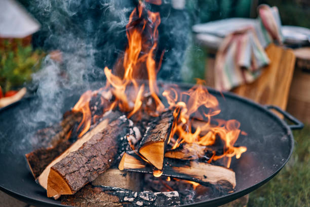istock Making an Open Campfire for Outdoor Cooking 958883644