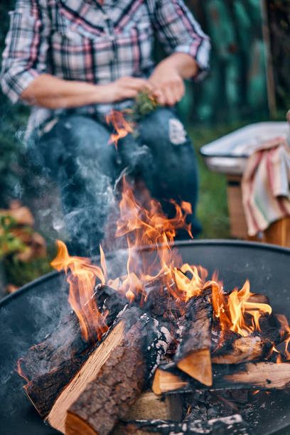 istock Making an Open Campfire for Outdoor Cooking 958883656