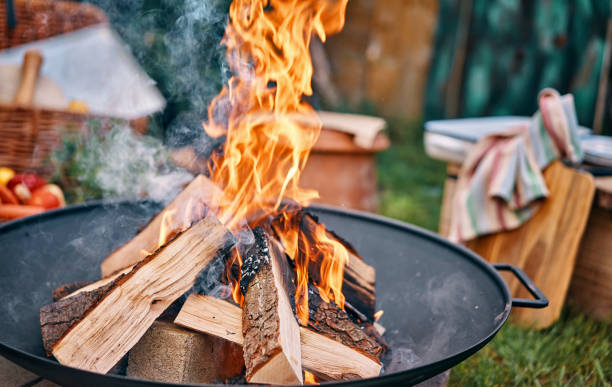 istock Making an Open Campfire for Outdoor Cooking 958883708