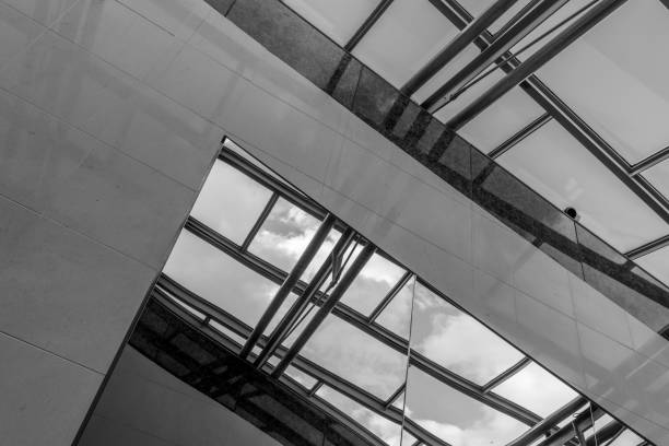 istock The glass architecture in city against a sky 958886336