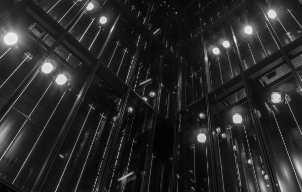 The modern glass architecture with illumination at night .