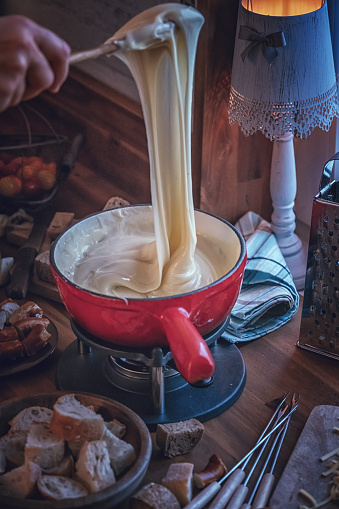 Delicious Swiss Cheese Fondue in a Pot Served with Bread