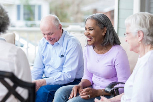 istock Cheerful senior woman visits friends 958888008