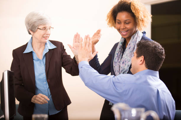 istock Business people celebrate team accomplishment. 958890170