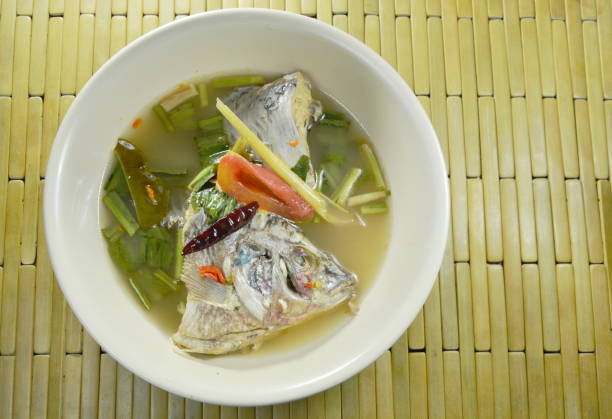 istock spicy boiled Tilapia fish head in Tom Yum soup 958895848
