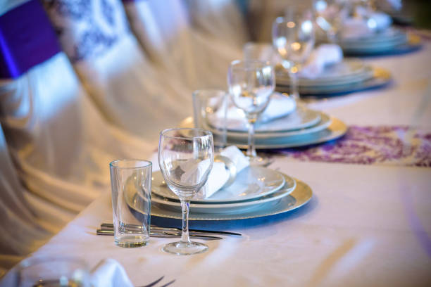 istock Beautiful table setting with crockery and flowers for a party, wedding reception or other festive event. 958897284