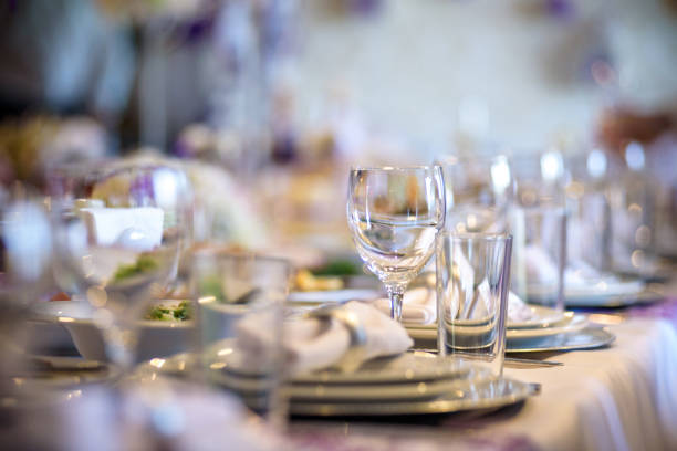 istock Beautiful table setting with crockery and flowers for a party, wedding reception or other festive event. 958901980