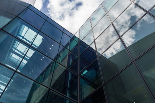 istock The glass architecture in city against a sky 958902732