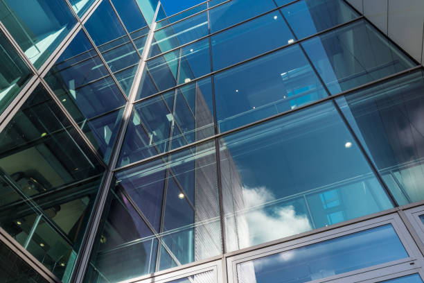 istock The glass architecture in city against a sky 958903848