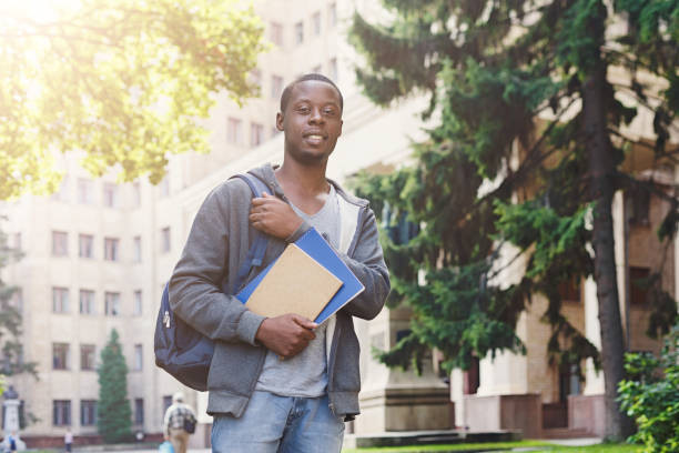 istock African-american student with books at university 958909312