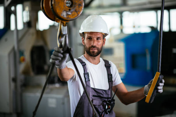 istock Male factory worker using lifting beam 958913898