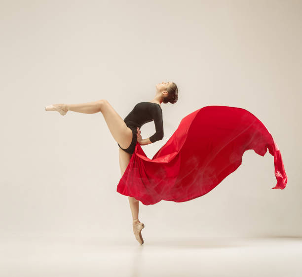 istock Modern ballet dancer dancing in full body on white studio background 958913984