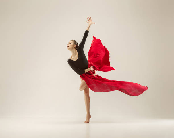 istock Modern ballet dancer dancing in full body on white studio background 958915104