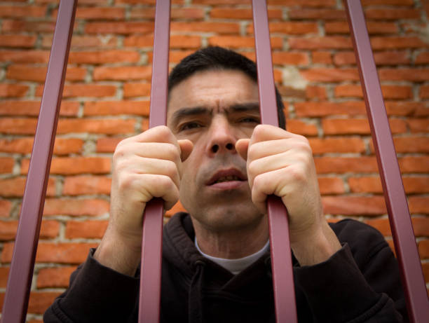 istock The prisoner behind the bars 958915400