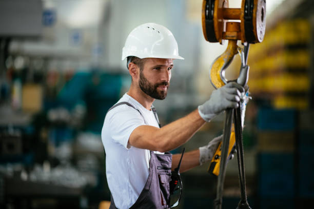 istock Male factory worker using lifting beam 958917998