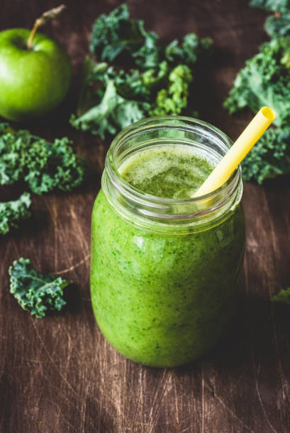 istock Healthy green smoothie on wooden table 958918496