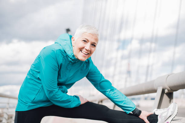istock Mature woman exercising and smiling 958918574