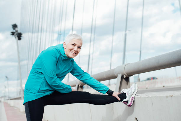 istock Happy mature woman exercising 958918576