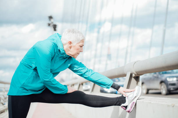 istock Mature woman stretching 958918578