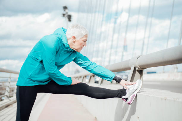 istock Mature woman exercising 958918590