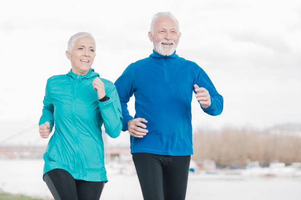 istock Joyful senior couple exercising outdoors 958920262