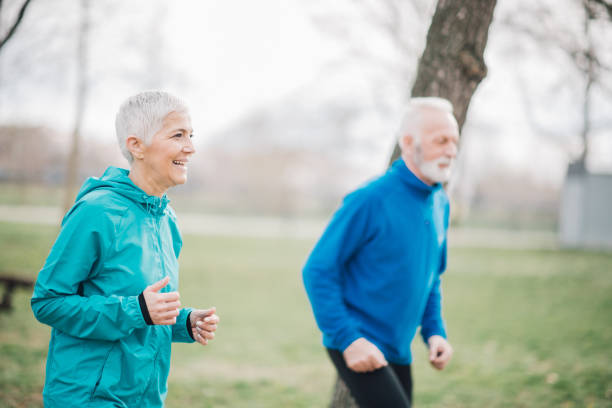 istock Happy and exhausted couple jogging 958920322