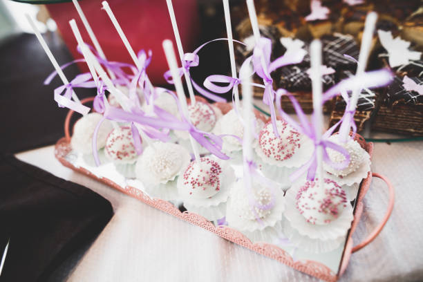 istock Delicious sweets on wedding candy buffet with desserts, cupcakes 958923192