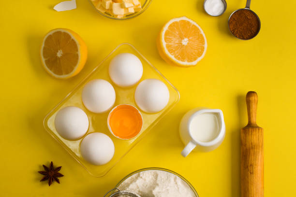 istock Baking flat lay background with eggs floor butter lemon sieve 958923648