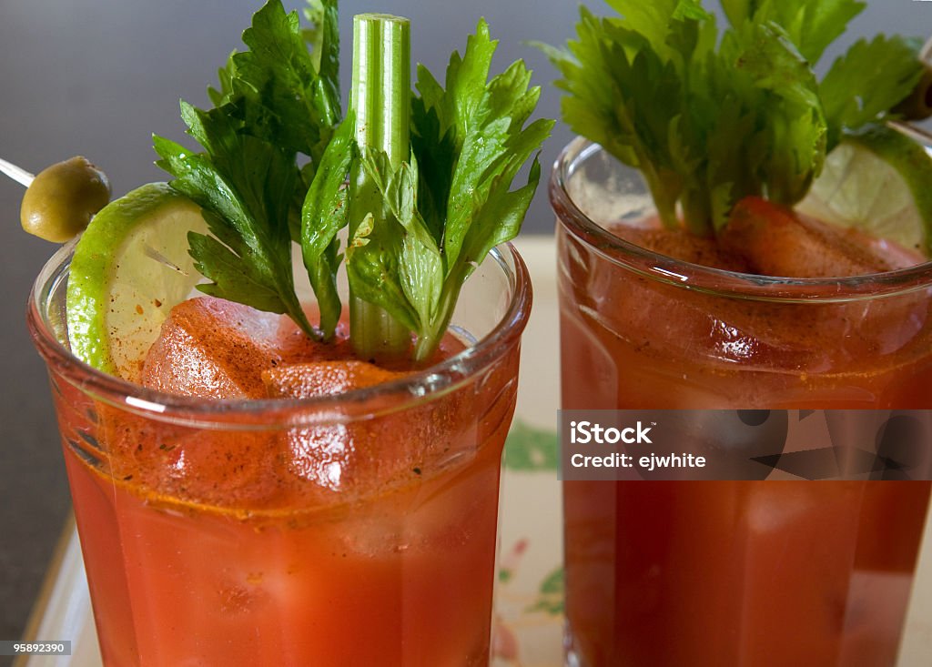 Two Glasses Of Bloody Marys With Celery And Other Garnish Stock Photo -  Download Image Now - iStock