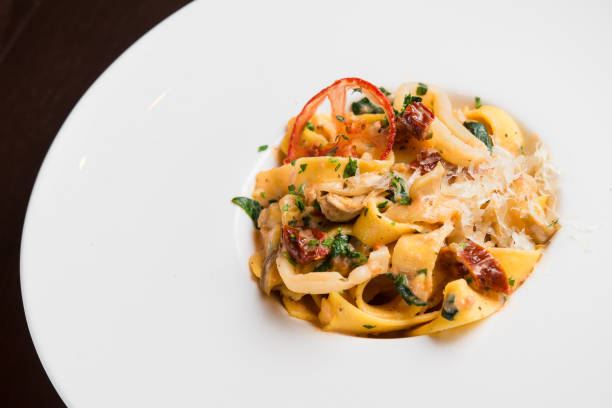 istock delicious pasta with chicken and tomato 958926756