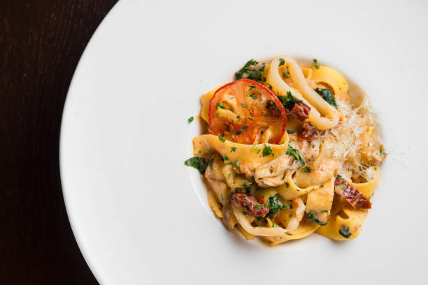 istock delicious pasta with chicken and tomato 958928104