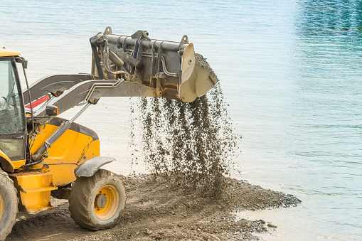 Construction machinery, bulldozer is working on the harvesting of gravel