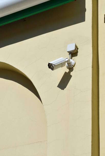 istock Video camera attached to the wall 958928936