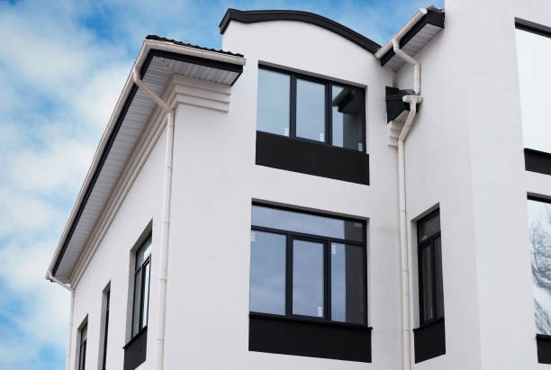 istock Newly installed construction frame house rain gutter system on the roof top 958931214