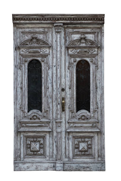 istock Very old vintage rustic wooden doors isolated on white background 958936516
