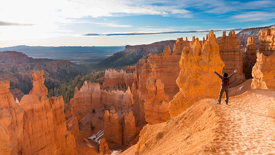 mature asian woman hiking Bryce Canyon National Park. Thor's hammer