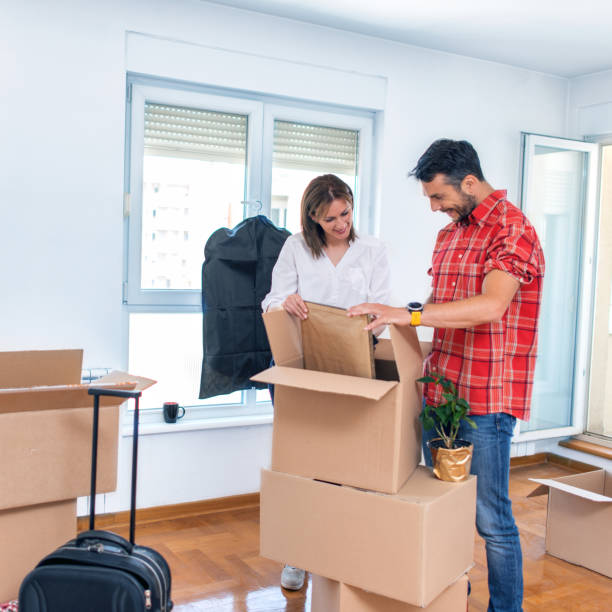 istock Couple moving into their new home 958937050