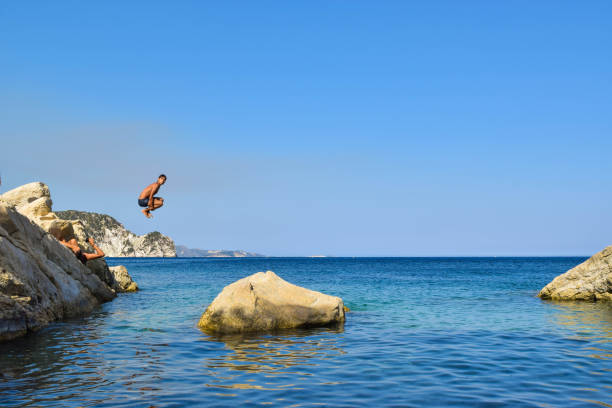 istock Jump into the sea. 958937108